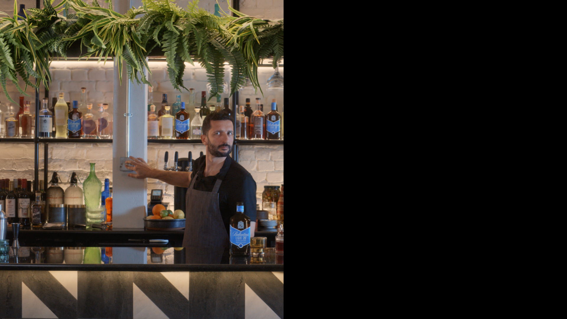Bartender switching lights in "half an ad" for Ballantine's Light by CPB London